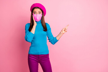 Portrait of her she nice trendy modern scared afraid healthy girl wearing safety gauze mask demonstrating advice mers sars cov ncov-2 copy space isolated over pink pastel color background