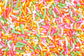 Fototapeta na wymiar Colorful rainbow sprinkles sugar texture pattern background. for cake , bakery and ice-cream or other