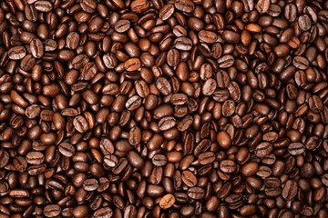 Top view of brown roasted coffee beans, can be use as background, copy space for text.