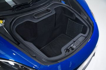Open front boot space of blue sports car