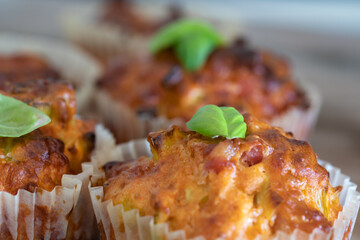 Fresh baked savory muffin. With herb spread and sprinkled with basil. healthy muffin. fresh baked food