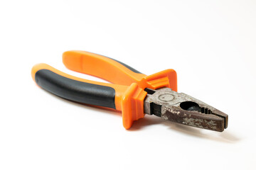 orange pliers on a white background