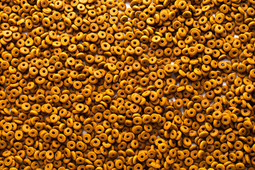 Dried dog food background. Top view Brown grain pet food banner background  with copy space of test design. Above or Top view. food panorama banner..