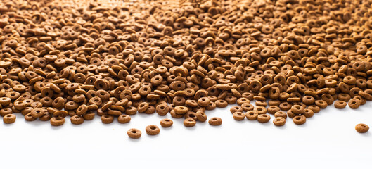 Dried dog food background. Top view Brown grain pet food banner background  with copy space of test design. Above or Top view. food panorama banner..
