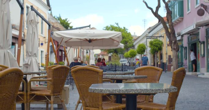 Empty tables and chairs await tourists on the restaurant&rsquo;s terrace after the, covid-19 pandemic.