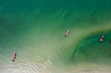 Aerial view of Small fishing boat In the sea,on the beach Southern Thailand