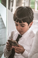 Young Spanish boy and smart phone