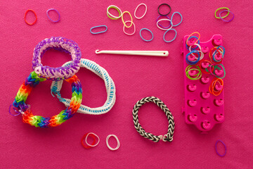 Chaos and order. Rubber bands for weaving loose and bracelet of rubber bands