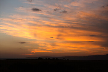 Sunset at Masai Mara with dramatic sky, Kenya