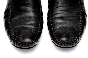 Black leather men used shoes on a white background.