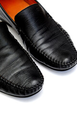Black leather men used shoes on a white background.