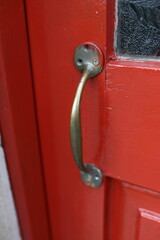 Brass Door Handle on Red Door