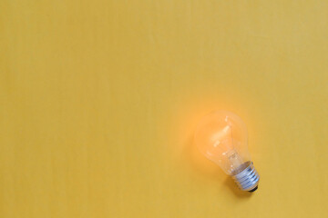 The light bulb in the yellow background