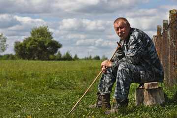 senior man sitting on a bench outdoor