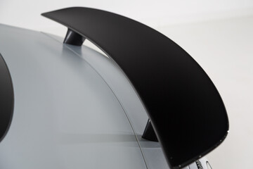 Close up shot of a rear spoiler on a sports car