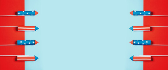 July 4, rockets for fireworks on a blue red background with space for text. in the style of...
