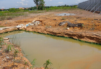 MALACCA, MALAYSIA -OCTOBER 26, 2015: Check dam or silt trap at the construction site. Soil and mud...