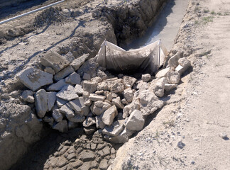 MALACCA, MALAYSIA -OCTOBER 26, 2015: Check dam or silt trap at the construction site. Soil and mud from the construction site in strained and precipitated. Only clean water discharged. 