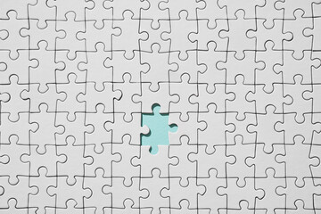 Background of white puzzle with missing piece