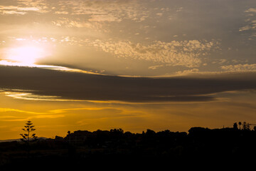 clouds and silhouettes at sunset