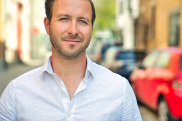 Portrait of an handsome man on the urban background