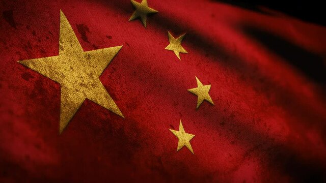 Chinese flag covered in dirt and grime waving in the wind, close up flag of China