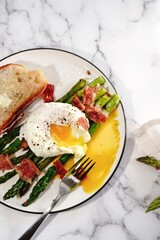 Poached egg with grilled asparagus, selective focus