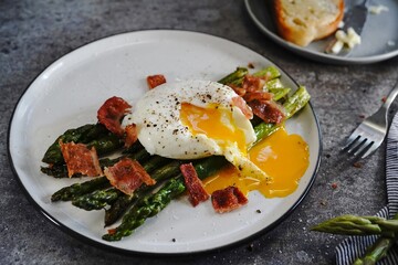 Poached egg with grilled asparagus, selective focus