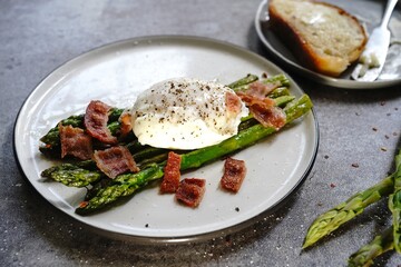 Poached egg with grilled asparagus, selective focus
