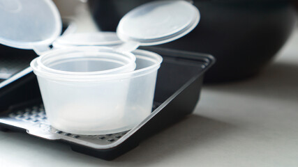 Empty plastic containers for sushi set delivery. Take away lunch box