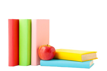 Composition of school books and an apple isolated on white wooden background