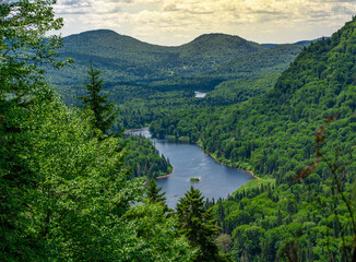Obraz na płótnie Canvas Awesome summer view from a verdant hill in Jacques Cartier National Park, Quebec province, Canada