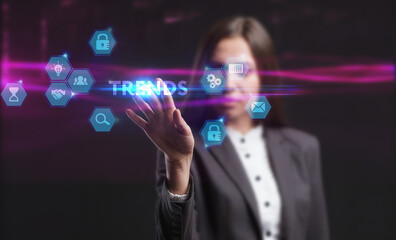 Business, Technology, Internet and network concept. Young businessman working on a virtual screen of the future and sees the inscription: Trends
