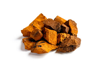 chaga mushroom. a pile of large pieces natural wild birch fungus chaga isolated on white background