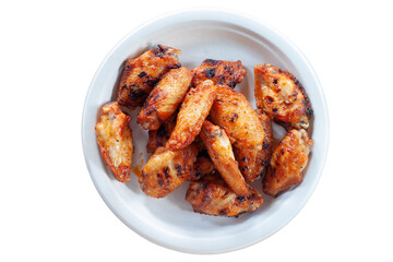 Grilled chicken wings in a white plate made from natural plant fiber isolated on white background...