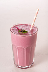 Berry lassi from fermented baked milk. Sour-milk shake.