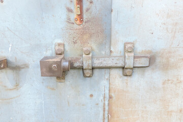     A padlock on a   on the metal garage door