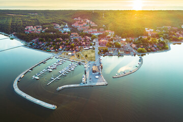 Nida city evening aerial view with yacht pier and forests in Curonian spit, Lithuania - obrazy, fototapety, plakaty
