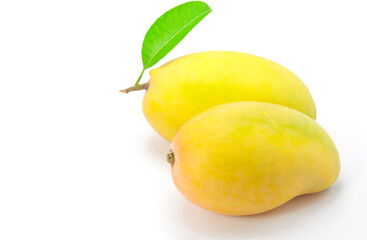 Ripe mango with green leaf on white background.
