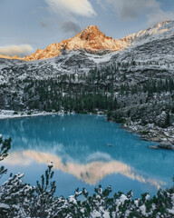 Mountain lake with blue water. Sunrise in the mountains. Lake Sorapis in the Dolomites. Lago di Sorapis.