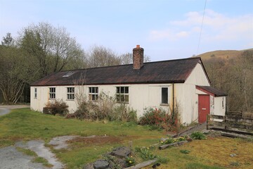 Obraz premium An historic corrugated Welsh building which has had many uses including a forestry camp.