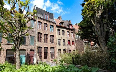 Row of old houses in Place Gilleson behind Notre-Dame de la Treille Cathedral in Lille, France