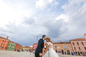 beautiful wedding couple posing in square