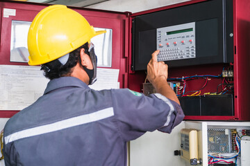 Technician Checking doing work Maintenance fire alarm system in a factory Fire protection Factory safety Qiao Shan Installation control detector emergency risk - obrazy, fototapety, plakaty