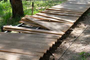 Forest path lined with wooden blocks. Footpath blocked for repair.