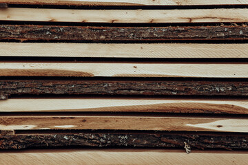 Piles of wooden boards in the sawmill, planking. 