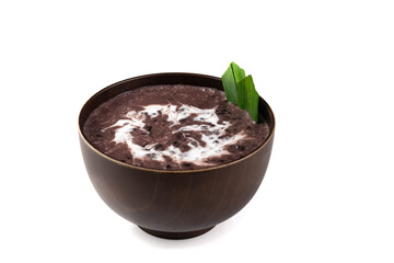 Black Glutinous Rice Porridge or Bubur Pulut Hitam in Malay with coconut milk on white background