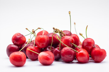 heap of ripe cherries on white background