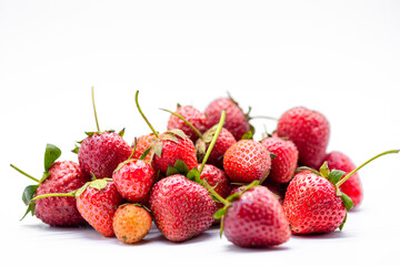 heap of ripe strawberries on white background