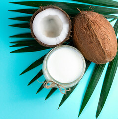 coconut oil and coconut on a blue background